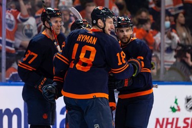 Edmonton Oilers' Zach Hyman (18) celebrates a goal on Pittsburgh Penguins' goaltender Tristan Jarry (35) during third period NHL action at Rogers Place in Edmonton, on Wednesday, Dec. 1, 2021. The goal, which was celebrated as a hattrick, was ruled off.