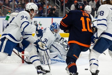 Toronto Maple Leafs' goaltender Jack Campbell (36) stops Edmonton Oilers' Derek Ryan (10) during first period NHL action at Rogers Place in Edmonton, on Tuesday, Dec. 14, 2021.