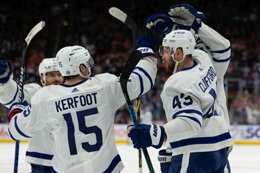 Toronto Maple Leafs' TJ Brodie (78) celebrates a goal on Edmonton Oilers' goaltender Mikko Koskinen (19) with teammates during second period NHL action at Rogers Place in Edmonton, on Tuesday, Dec. 14, 2021.