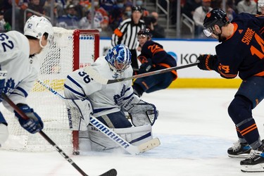 Edmonton Oilers' Devin Shore (14) is stopped by Toronto Maple Leafs' goaltender Jack Campbell (36) during third period NHL action at Rogers Place in Edmonton, on Tuesday, Dec. 14, 2021.