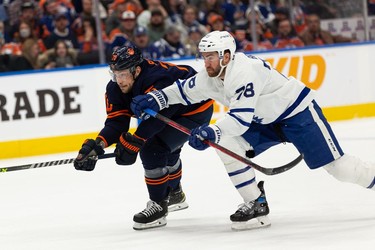 Edmonton Oilers' Colton Sceviour (70) races Toronto Maple Leafs' TJ Brodie (78) during third period NHL action at Rogers Place in Edmonton, on Tuesday, Dec. 14, 2021.