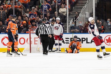 Edmonton Oilers' Connor McDavid (97) reacts to a fall into Columbus Blue Jackets' goaltender Elvis Merzlikins' (90) net during second period NHL action at Rogers Place in Edmonton, on Thursday, Dec. 16, 2021.