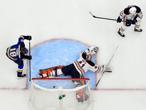 Dec 29, 2021; St. Louis, Missouri, USA; St. Louis Blues center Robert Thomas (18) shoots and scores against Edmonton Oilers goaltender Mike Smith (41) during the first period at Enterprise Center.