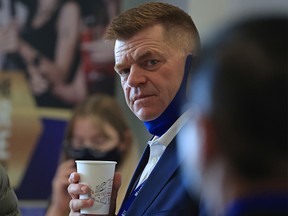 Brian Jean chats with fellow party members at the United Conservative Party AGM at the Grey Eagle Resort in Calgary on Saturday, November 20, 2021.