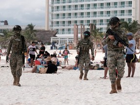 Members of the Navy patrol a beach resort as part of the vacation security in the tourist zone in Cancun by the government of Quintana Roo, Mexico, Dec. 5, 2021.