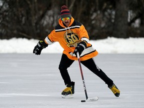 David Torres works on his stick handling skills at Victoria Park skating oval in Edmonton on Tuesday December 7, 2021. (PHOTO BY LARRY WONG/POSTMEDIA)