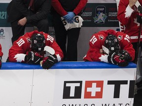 Dejected members of Team Canada sit on the bench after being defeated by the United States at the IIHF world junior championship gold-medal game on Jan. 5, 2021, in Edmonton.