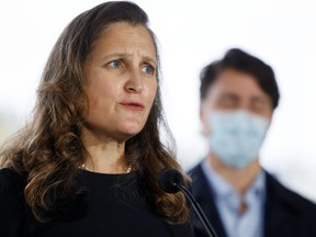 Deputy Prime Minister and Minister of Finance Chrystia Freeland and Prime Minister Justin Trudeau take part in a news conference outside the Children's Hospital of Eastern Ontario in Ottawa Oct. 21, 2021.