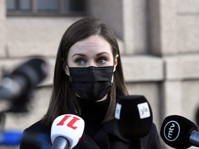 Finnish Prime Minister Sanna Marin holds a news conference outside the Finnish Parliament building in Helsinki, Finland Dec. 8, 2021.