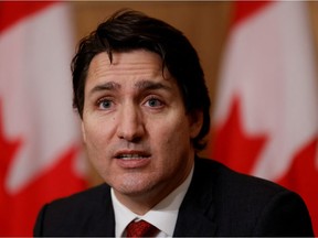 FILE PHOTO: Canada's Prime Minister Justin Trudeau takes part in a news conference in Ottawa, Ontario, Canada December 13, 2021. REUTERS/Blair Gable/File Photo