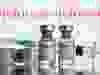 Vials labeled "COVID-19 Coronavirus Vaccine" and syringe are seen in front of displayed Johnson & Johnson logo in this illustration taken, February 9, 2021.