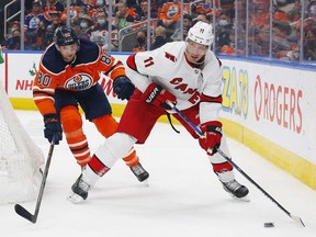 Carolina Hurricanes forward Jordan Staal (11) looks to make a pass in front of Edmonton Oilers defensemen Markus Neimelainen (80) during the second period at Rogers Place.