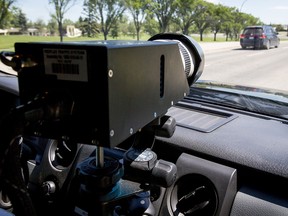 Photo radar in an unmarked police truck at work on 62nd Avenue N.W. in Calgary July 25, 2016.