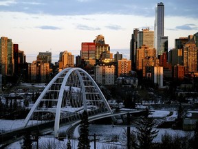 The rising sun illuminates the downtown Edmonton skyline on Thursday December 10, 2020.