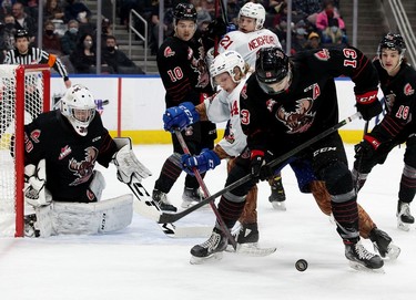 The Edmonton Oil Kings' Carter Souch (44) battle the Moose Jaw Warriors' Logan Doust (13) during first period WHL action at Rogers Place, in Edmonton Saturday Dec. 4, 2021.