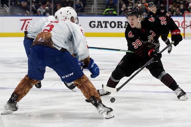 The Edmonton Oil Kings' Simon Kubicek (5) battle the Moose Jaw Warriors' Ryder Korczak (38) during second period WHL action at Rogers Place, in Edmonton Saturday Dec. 4, 2021.