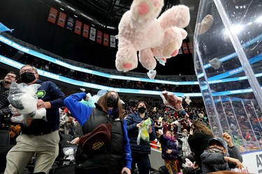 Fans throw teddy bears on to the ice following a first period goal during the Oil Kings' 14th annual Teddy Bear Toss, in Edmonton Saturday Dec. 4, 2021.