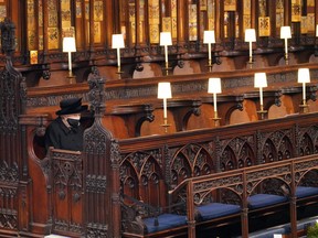 Queen Elizabeth sits alone ahead of the funeral of her husband of 73 years, Prince Philip, Duke of Edinburgh, at St George's Chapel at Windsor Castle on April 17, 2021.