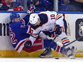 Filip Chytil (72) of the New York Rangers is checked by Derek Ryan (10) of the Edmonton Oilers at Madison Square Garden on Monday, Jan. 03, 2022, in New York City.