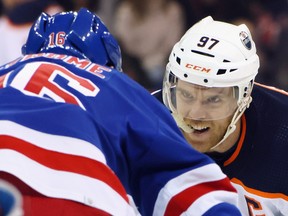 Connor McDavid (97) of the Edmonton Oilers faces off with Ryan Strome (16) of the New York Rangers at Madison Square Garden on Monday, Jan. 03, 2022, in New York City.