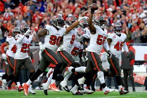 Shaquil Barrett #58 of the Tampa Bay Buccaneers celebrates after intercepting a pass against the Philadelphia Eagles during the third quarter in the NFC wild card game at Raymond James Stadium on January 16, 2022 in Tampa, Florida.