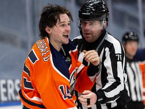 Edmonton Oilers’ Josh Archibald (15) reacts after tussling with Toronto Maple Leafs’ Travis Dermott (23) at Rogers Place in Edmonton on March 1, 2021.