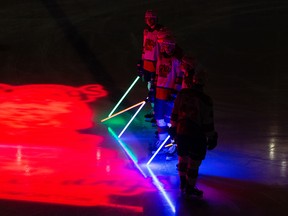 The Oil Kings are seen with lightsabers before they face the Swift Current Broncos on Star Wars Night at Rogers Place in Edmonton on Saturday, Jan. 29, 2022.