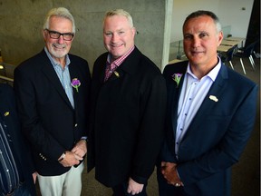Clark Gillies, left, poses with former Oilers Marty McSorley and Paul Coffey at an event in Calgary in 2017.