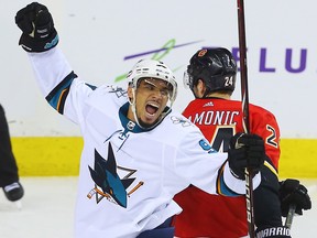 San Jose Sharks' Evander Kane celebrates after scoring against the Calgary Flames at the Scotiabank Saddledome in Calgary on on March 16, 2018.