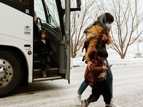 Some of 170 Afghan refugees arrived in Edmonton on Friday, Jan. 14, 2022, and were welcomed by Catholic Social Services, who will assist them in resettling. The group includes human rights defenders and their families who were able to flee to Pakistan and were put on a Canada-arranged charter flight on Jan. 11, 2022.
