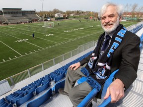 FC Edmonton owner Tom Fath poses for a photo in the new seating at Clarke Stadium on May 10, 2013.