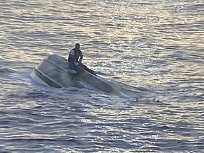 This handout image, provided by the US Coast Guard on January 25, 2022, shows a capsized vessel approximately 45 miles east of Fort Pierce inlet, Florida.