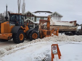 Edmonton snow clearing crews work in Griesbach as part of a pilot to clear windrows in a residential neighbourhood on Jan. 21, 2022.