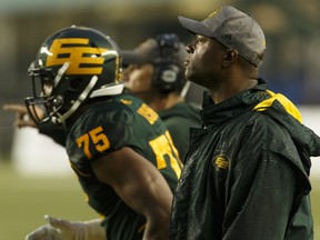 Edmonton Elks defensive-lilne coach Demetrious Maxie (right) talks to players during a game against the Toronto Argonauts at Commonwealth Stadium in Edmonton on July 13, 2018.