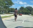 Cleveland Browns defensive back Malik McDowell strolls down a Florida street.