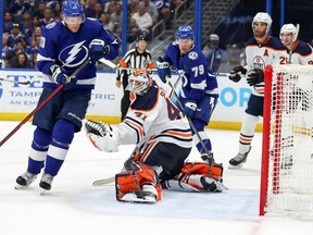 Corey Perry #10 of the Tampa Bay Lightning scores a goal past Mike Smith #41 of the Edmonton Oilers during the second period at the Amalie Arena on February 23, 2022 in Tampa, Florida.
