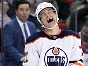 Ryan McLeod of the Edmonton Oilers laughs in a game against the Carolina Hurricanes at PNC Arena on Sunday, Feb. 27, 2022, in Raleigh, N.C.
