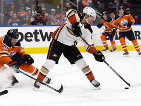 The Anaheim Ducks' Trevor Zegras (46) battles the Edmonton Oilers at Rogers Place in Edmonton on Oct. 19, 2021.