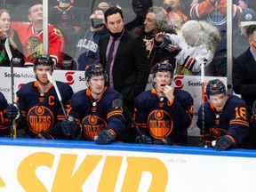 Edmonton Oilers’ new head coach Jay Woodcroft is seen behind the bench as the team plays the New York Islanders during second period NHL action at Rogers Place in Edmonton, on Friday, Feb. 11, 2022.