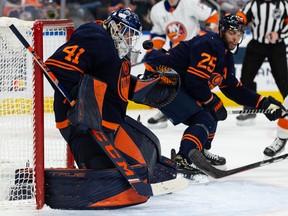 Edmonton Oilers goaltender Mike Smith (41) makes a save against the New York Islanders at Rogers Place in Edmonton on Friday, Feb. 11, 2022.