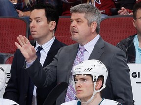 Assistant coach Jay Woodcroft and head coach Todd McLellan, then with the San Jose Sharks, lead the way to a 5-3 win over the Arizona Coyotes at Gila River Arena in this file photo from April 4, 2015, in Glendale, Arizona.