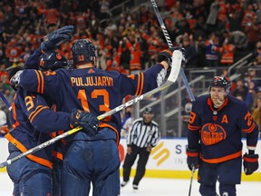 The Edmonton Oilers celebrate a goal by forward Jesse Puljujarvi (13) against the New York Islanders at Rogers Place on Friday, Feb. 11, 2022.