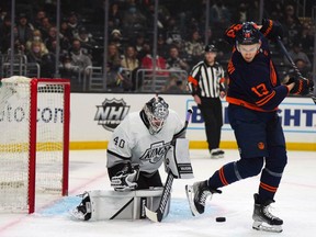 LA Kings goaltender Cal Petersen (40) defends the goal against Edmonton Oilers right wing Jesse Puljujarvi (13)  in the first period at Crypto.com Arena.