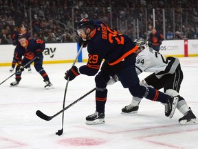 Edmonton Oilers center Leon Draisaitl (29) shoots the puck against LA Kings center Phillip Danault (24) in the first period at Crypto.com Arena on Feb. 15, 2022.