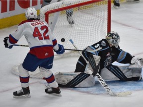 Edmonton Oil Kings Justin Sourdif (42) scores on Winnipeg Ice goalie Daniel Hauser (31) at Rogers Place in Edmonton on Feb. 21, 2022.