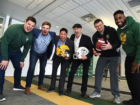 Edmonton Elks offensive lineman Mark Korte, left, University of Alberta Students' Union president Rowan Ley, Elks president and CEO Victor Cui, U of A athletics director Ian Reade, U of A Golden Bears head coach Chris Morris and Golden Bears offensive lineman Rodeem Brown are on hand Tuesday, Feb. 15, 2022, to announce the first double header featuring games with both teams at Commonwealth Stadium scheduled for Oct. 15, 2022.