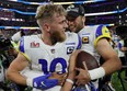 Los Angeles Rams' Cooper Kupp and Matthew Stafford celebrate after winning Super Bowl LVI on Feb. 13, 2022.