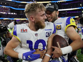 Los Angeles Rams' Cooper Kupp and Matthew Stafford celebrate after winning Super Bowl LVI on Feb. 13, 2022.