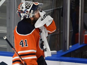 Edmonton Oilers goalie Mike Smith (41) visits the bench after the Minnesota Wild scored at Rogers Place in Edmonton on Feb. 20, 2022.