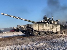This handout video grab released by the Russian Defence Ministry on Tuesday, Feb. 15, 2022, shows Russian tanks leaving for Russia after joint exercises of the armed forces of Russia and Belarus as part of an inspection of the Union State's Response Force, at a firing range near Brest, Belarus.